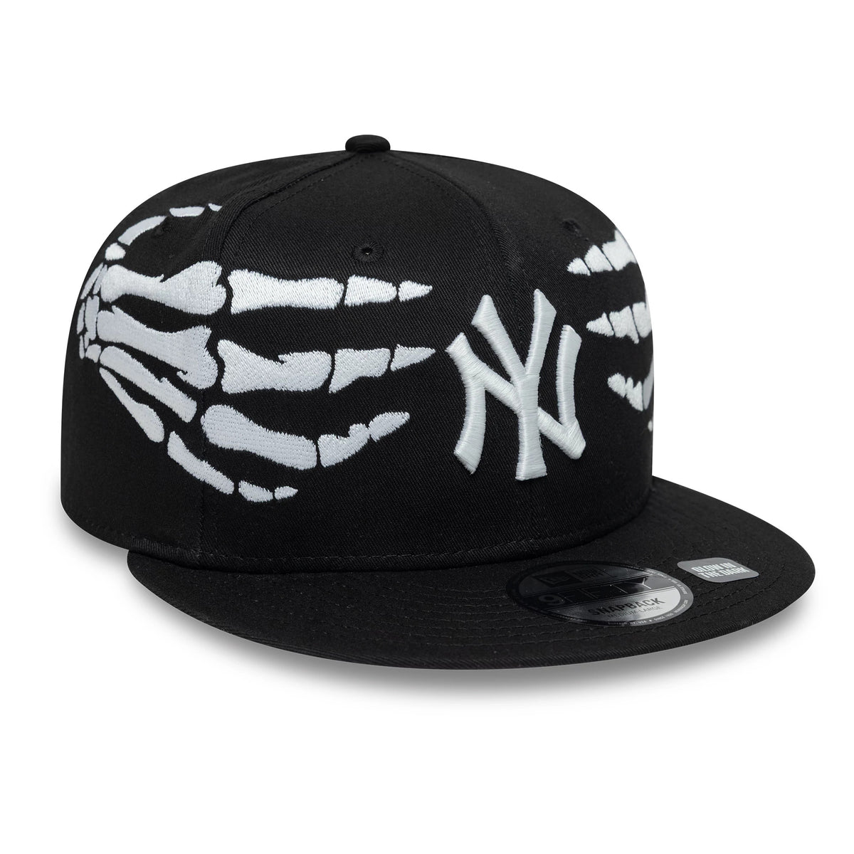 Yankees MLB Halloween Glow In The Dark Hands Black New Era 9FIFTY Snapback Adjustable Cap, three-quarter view showing the white embroidered NY logo on the front panel, raised white skeleton hand graphics wrapping sides.