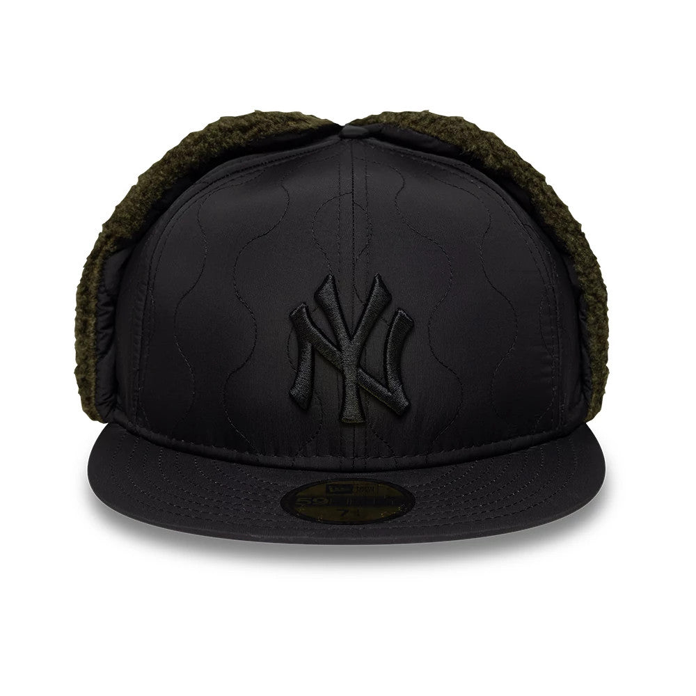 New York Yankees MLB Quilted Black Dogear New Era 59FIFTY Fitted Cap, front view showing the raised black embroidered Yankees logo on the quilted front panels, matching flat black visor with 59FIFTY size sticker, and green fur-lined dogears.