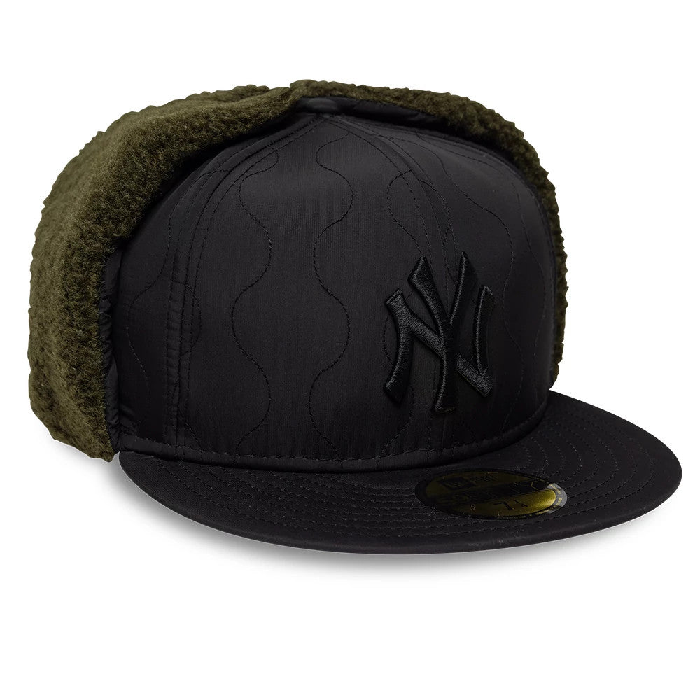 New York Yankees MLB Quilted Black Dogear New Era 59FIFTY Fitted Cap, three-quarter view showing a raised black embroidered Yankees logo on the front panel, olive green quilted dogears, and a black visor with a gold 59FIFTY size sticker.