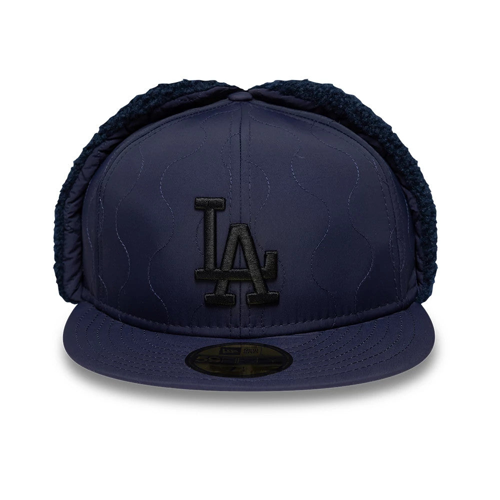 LA Dodgers MLB Quilted Navy New Era Dogear 59FIFTY Fitted Cap, front view showing the black raised embroidered LA logo on the quilted navy front panel, navy flat visor with gold 59FIFTY size sticker, and attached dogear flaps.