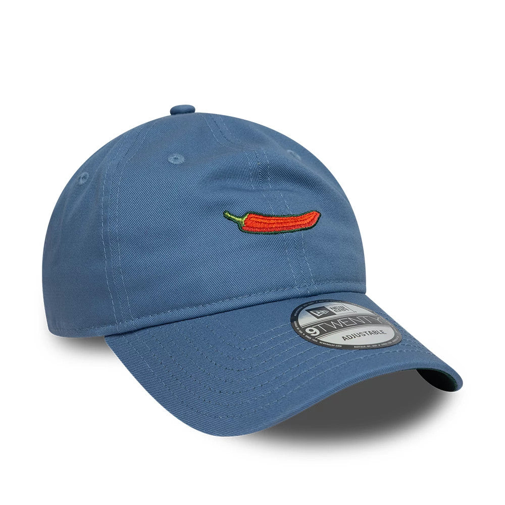 Carlos Sainz Team Fifty5 Chilli Blue New Era 9TWENTY Adjustable Cap, front view showing an embroidered red chilli pepper logo centred on the blue structured crown, curved visor and a 9TWENTY size sticker placed on the visor.