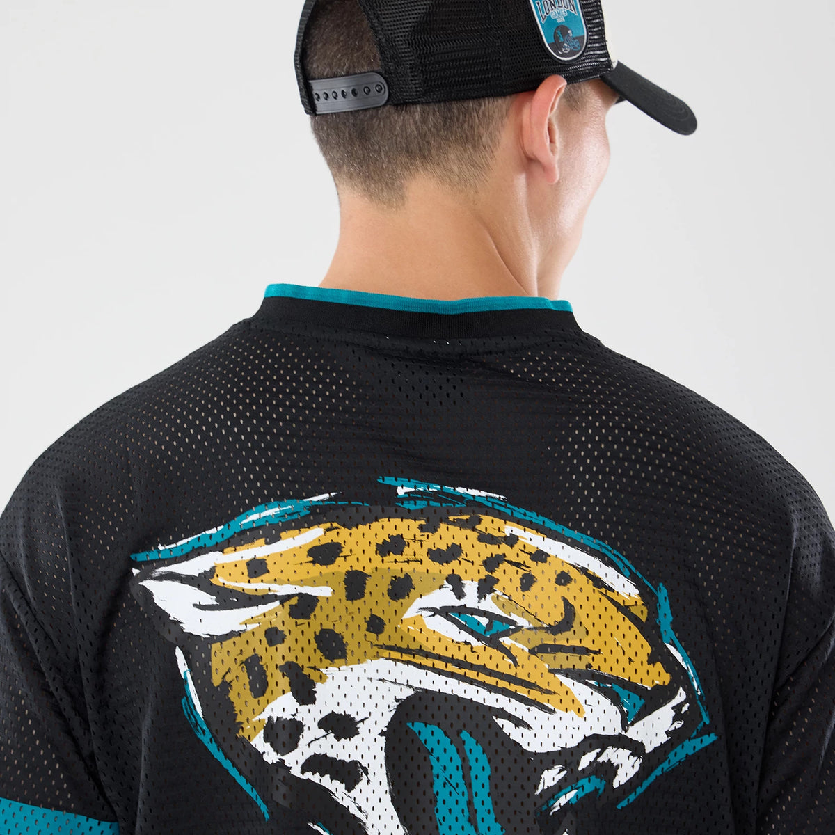 The model is wearing this NFL International Games 2026 Graphic Jacksonville Jaguars Mesh Jersey in black. 7