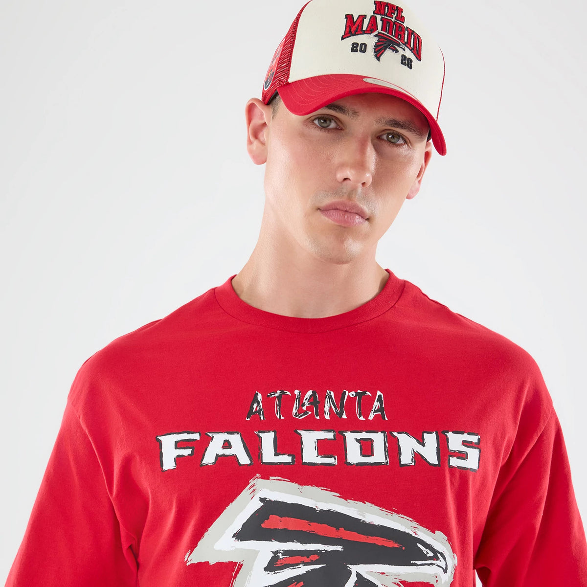 The model is wearing this NFL Graphic Slogan Atlanta Falcons Oversized T-Shirt in red. 7
