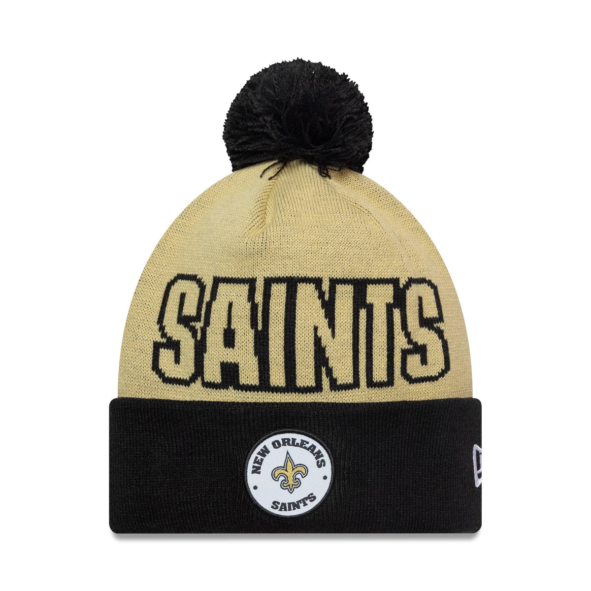New Era New Orleans Saints NFL International Games 2026 Paris Light Beige Cuff Knit Beanie Hat, front view showing black SAINTS lettering across the light beige crown, with a black pom-pom on top.