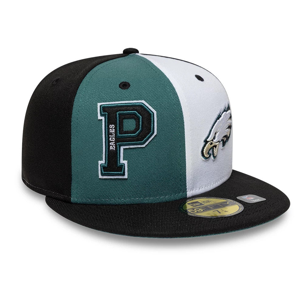 Eagles NFL International Games Black New Era 59FIFTY Fitted Cap, three-quarter view showing a large embroidered P logo on the green panel, an Eagles logo on the white panel, and a gold 59FIFTY size sticker on the black visor.