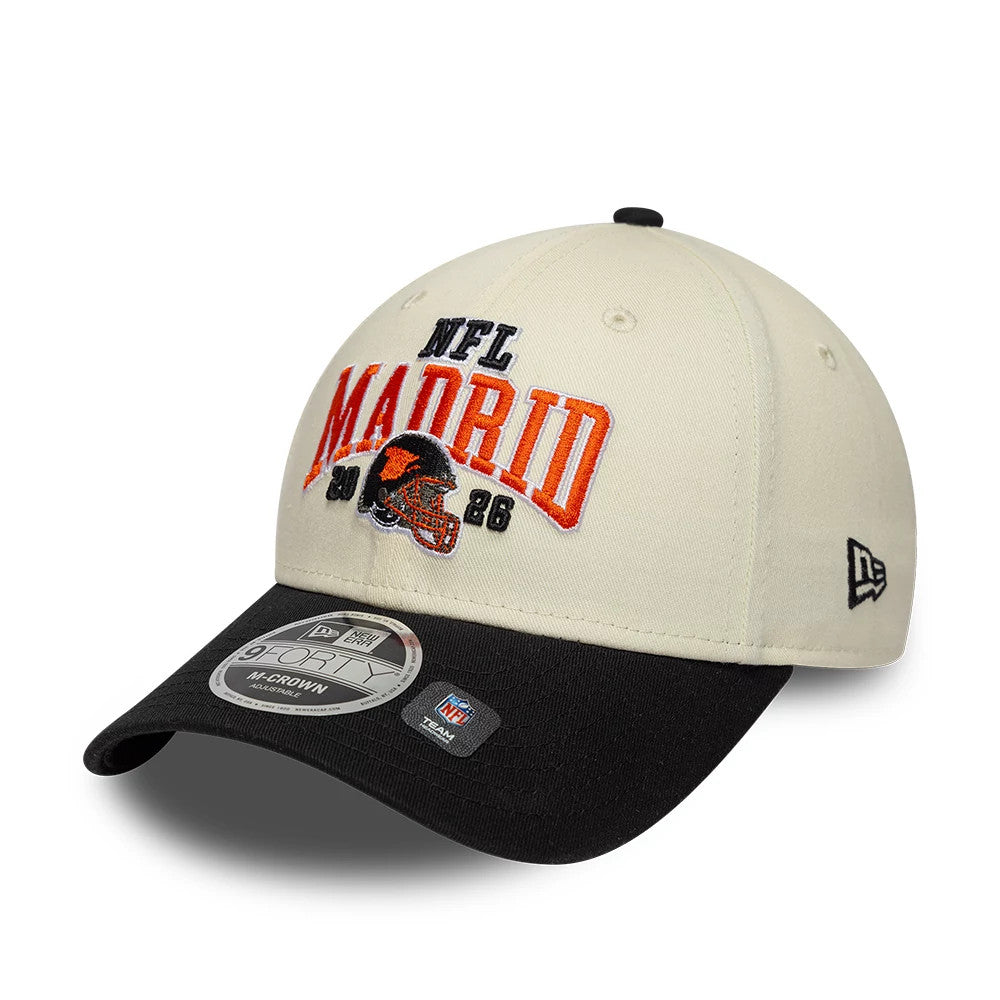 Bengals NFL International Games 2026 Madrid White & Black New Era 9FORTY M-Crown Adjustable Cap, front view showing raised embroidered NFL Madrid lettering in orange and black on the cream crown, with a 9FORTY size sticker on the black curved visor.