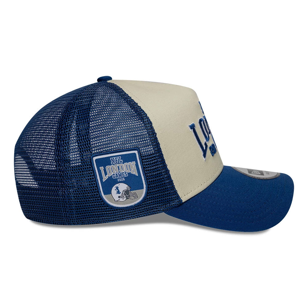 Colts NFL International Games 2026 London Blue New Era 9FORTY A-Frame Trucker Adjustable Cap, side view showing the blue mesh back panels, a blue and white NFL London Games patch on the side, and curved blue visor with a 9FORTY size sticker.