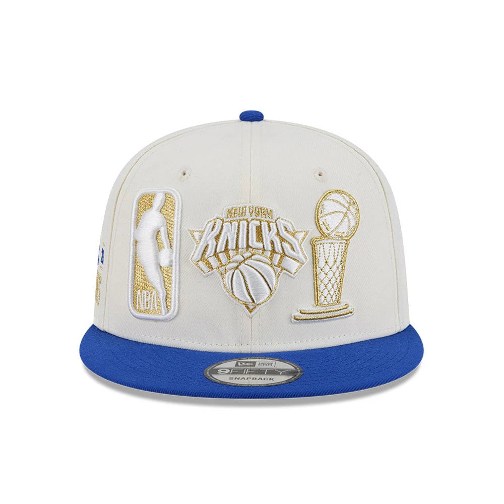 Pictured is this NBA '26 Ring Off New York Knicks 9FIFTY Snapback cap in blue. 3