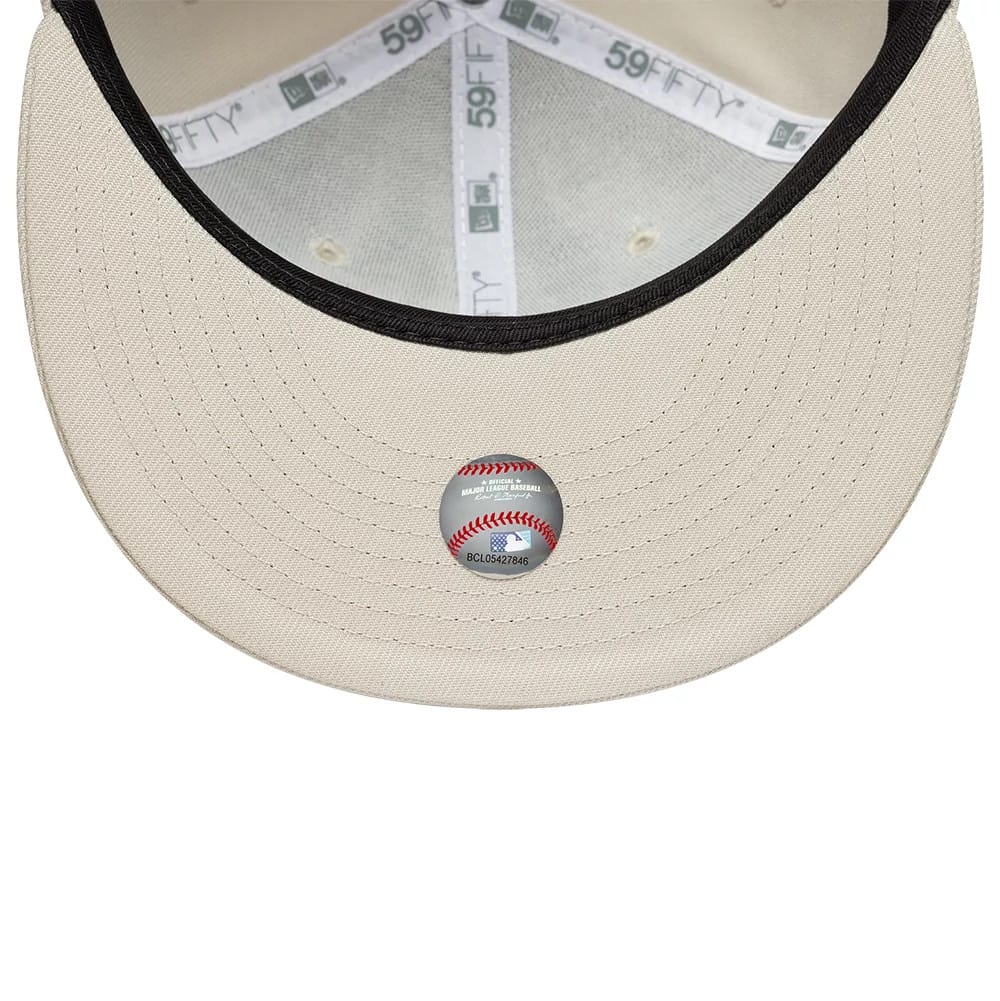 Pictured is this MLB New York Yankees 59FIFTY Fitted cap in light beige. 2