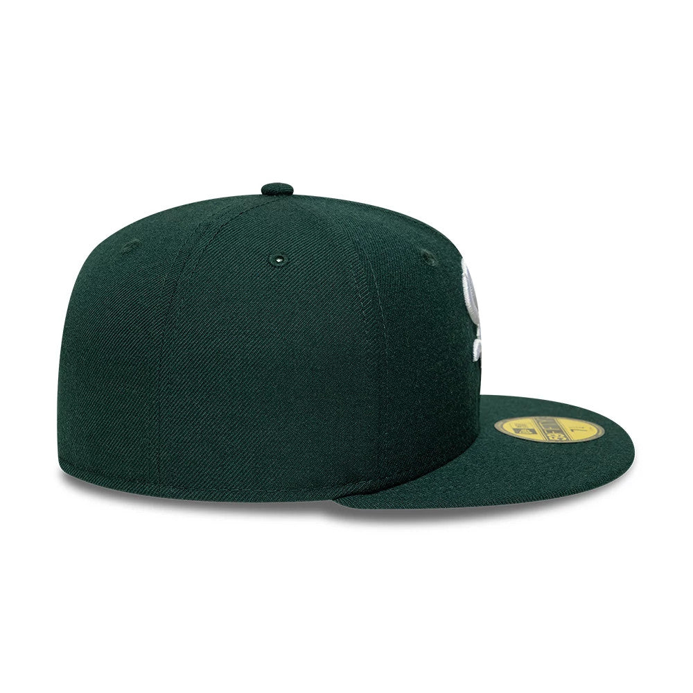 Chicago White Sox MLB Core Dark Green New Era 59FIFTY Fitted Cap, side view showing the white embroidered team logo on the front panel, with a flat dark green visor and a gold 59FIFTY size sticker on top.