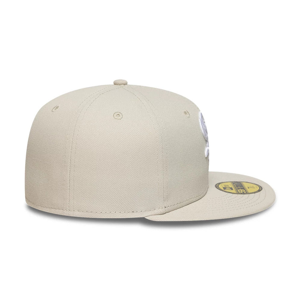 Chicago White Sox MLB Beige New Era 59FIFTY Fitted Cap, side view showing the beige New Era flag logo embroidered on the left side, with a flat beige visor featuring a gold 59FIFTY size sticker and matching eyelets and top button on the crown.