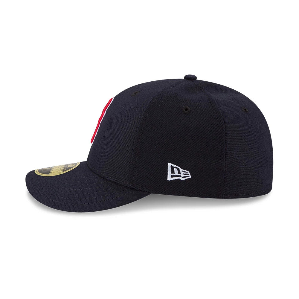Boston Red Sox Authentic Collection Low Profile New Era 59FIFTY, side view showing the white New Era flag logo on the left side, a structured navy crown with matching top button, and curved navy visor with a gold 59FIFTY size sticker.