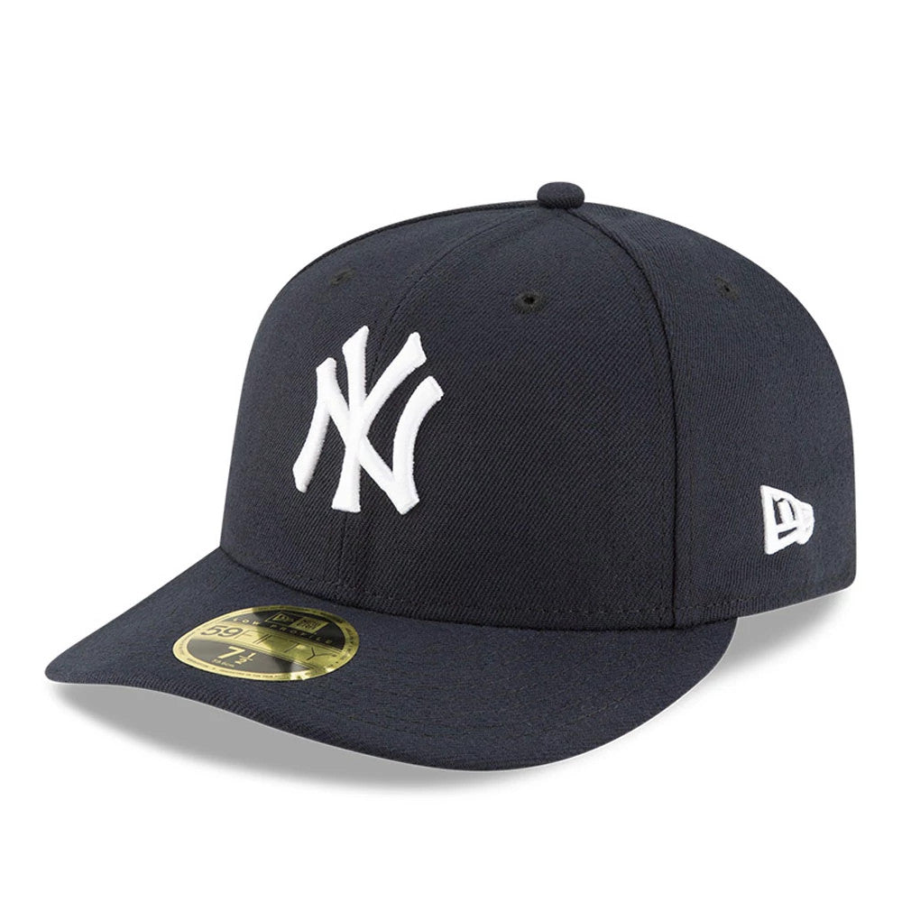 New York Yankees AC Perf Navy New Era 59FIFTY Low Profile Cap, three-quarter view showing the raised white embroidered NY logo on the structured navy crown, with a matching navy visor and a gold 59FIFTY size sticker on the visor.