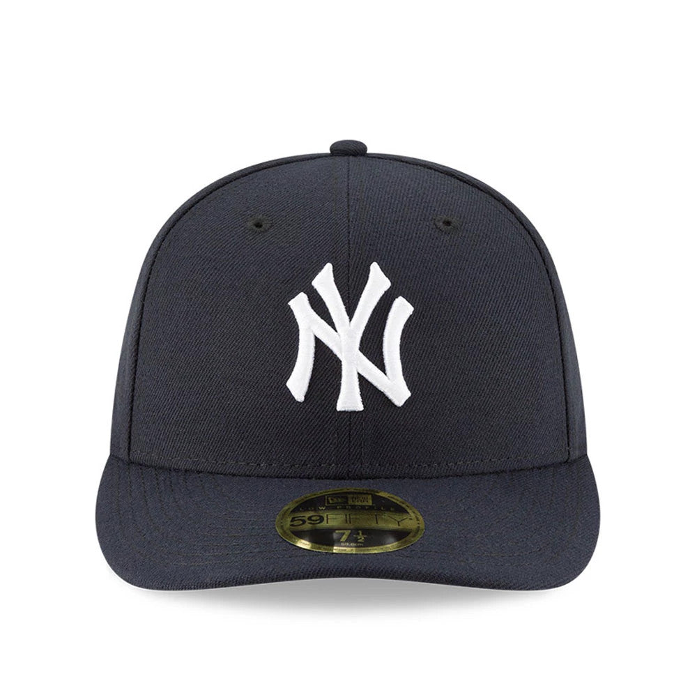 New York Yankees AC Perf Navy New Era 59FIFTY Low Profile Cap, front view showing the white embroidered NY logo on the structured navy crown, a navy visor, and a gold 59FIFTY size sticker placed on the centre of the visor.