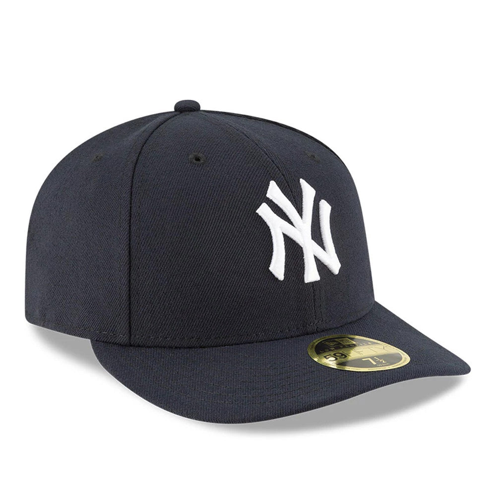 New York Yankees AC Perf Navy New Era 59FIFTY Low Profile Cap, three-quarter view showing the prominent white embroidered NY logo on the structured navy crown, with a flat visor and a gold 59FIFTY size sticker on the visor.