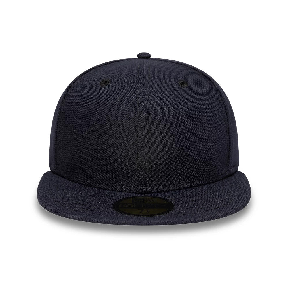 New Era Navy 59FIFTY Fitted Cap, front view showing a plain structured navy crown with matching eyelets and top button, a flat navy visor, and a gold 59FIFTY size sticker centred on the visor.