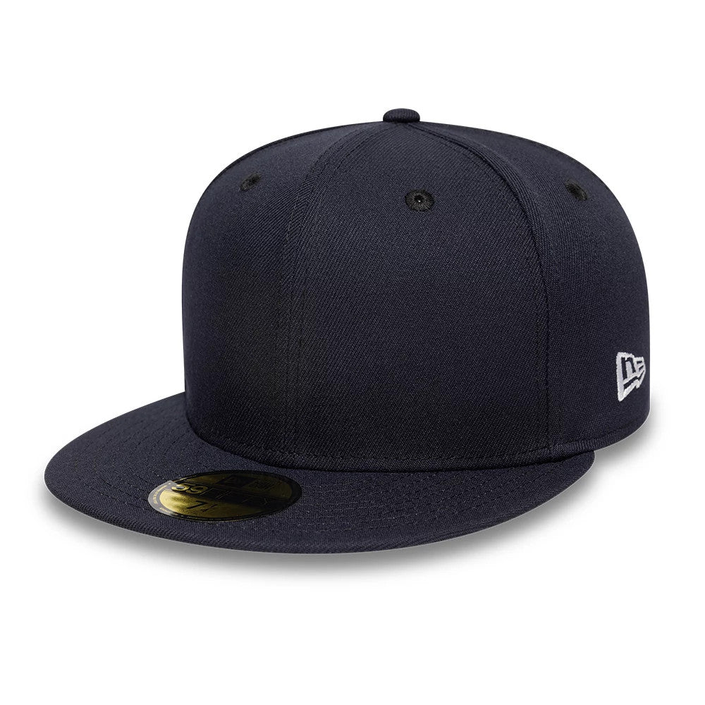 New Era Navy 59FIFTY Fitted Cap, side view showing the white embroidered New Era flag logo on the left side, a black eyeleted structured crown and a gold 59FIFTY size sticker on the flat navy visor.