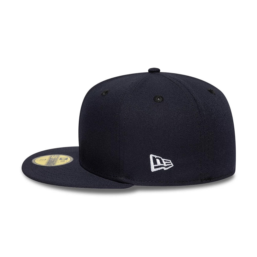 New Era Navy 59FIFTY Fitted Cap, three-quarter view showing the white embroidered New Era flag logo on the left side, a gold 59FIFTY size sticker on the navy flat visor, and the structured navy crown with black eyelets.