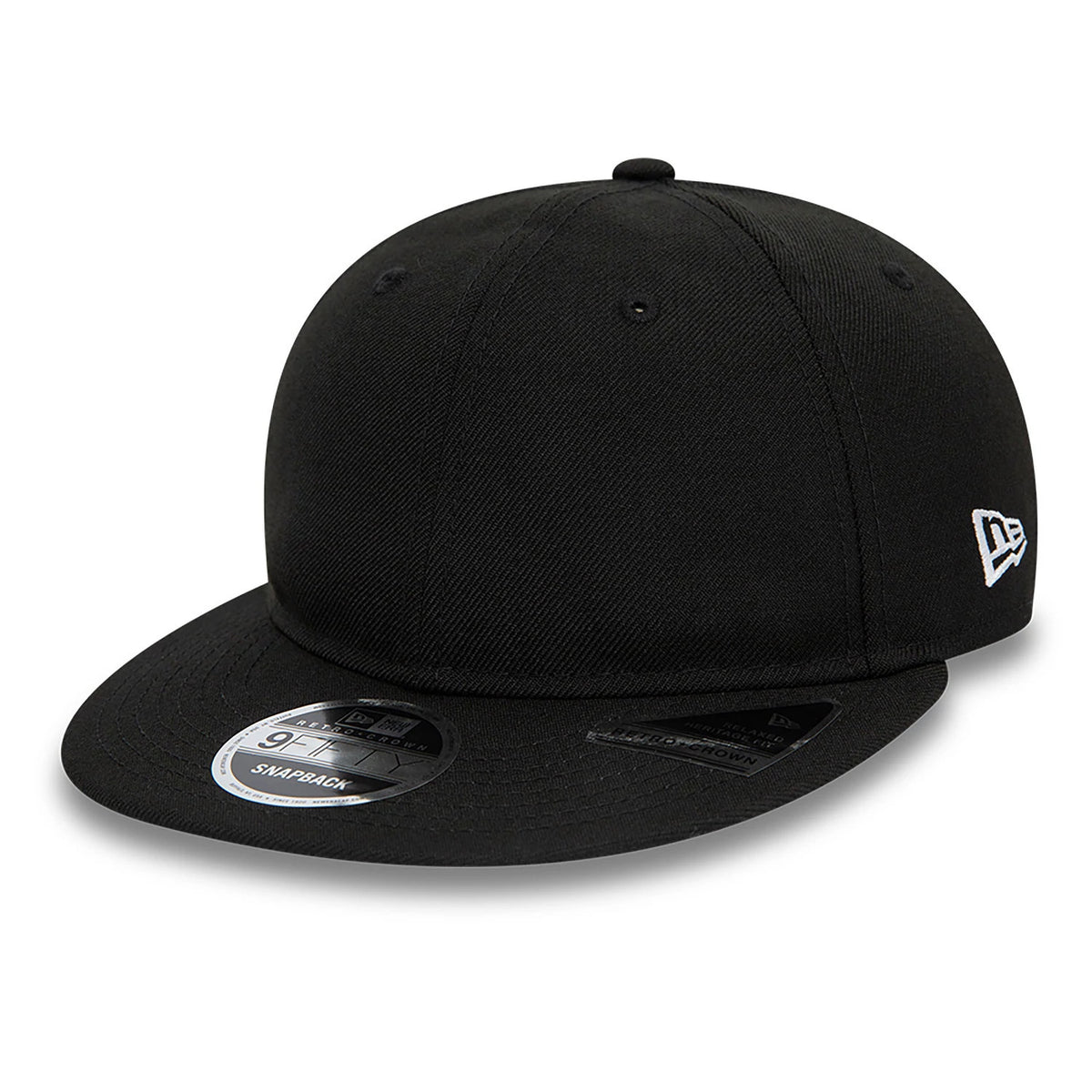 Blank New Era Black Retro Crown 9FIFTY Snapback Cap, three-quarter view showing the white embroidered New Era flag logo on the left side, flat black visor with a black undervisor, and the 9FIFTY size sticker on the visor.