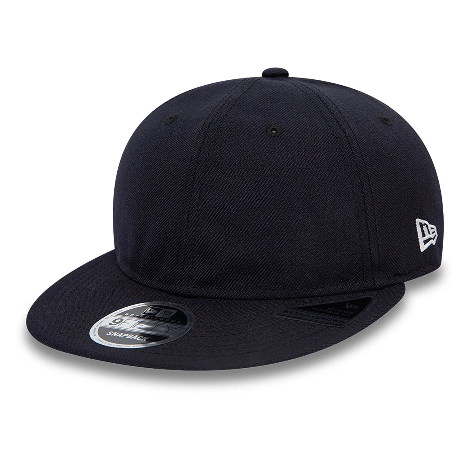 Blank New Era Navy Retro Crown 9FIFTY Snapback Cap, three-quarter view showing the navy structured crown, black flat visor with a 9FIFTY size sticker, and the white New Era flag logo embroidered on the left side.
