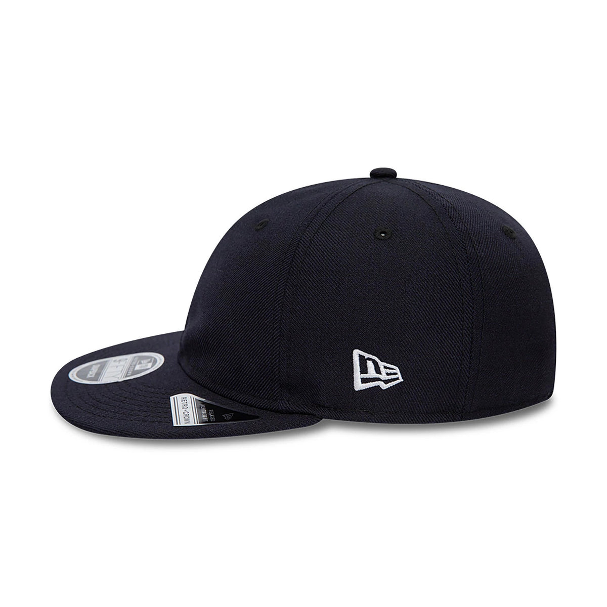 Blank New Era Navy Retro Crown 9FIFTY Snapback Cap, side view showing the white embroidered New Era flag logo on the left side of the structured navy crown, with a flat visor and a 9FIFTY size sticker on the top.