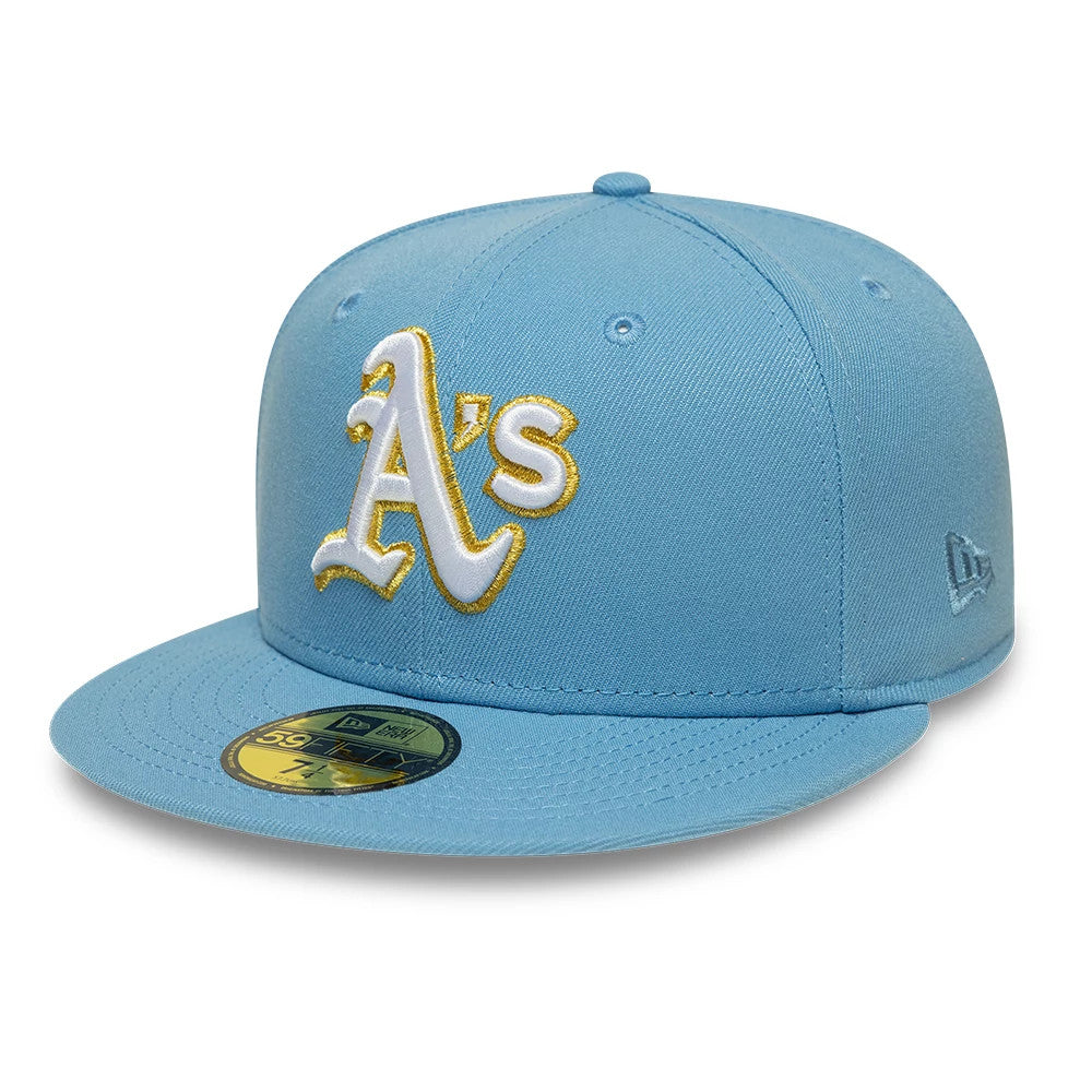 Athletics MLB Pastel Blue New Era 59FIFTY Fitted Cap, three-quarter view showing the large white and gold embroidered A’s logo on the front panels, pastel blue flat visor with gold 59FIFTY size sticker, and New Era flag logo on the left side.