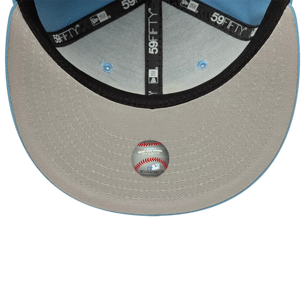 Athletics MLB Pastel Blue New Era 59FIFTY Fitted Cap, inside view showing black 59FIFTY taping and a black sweatband against the light grey fabric, with a grey undervisor featuring a baseball-shaped size sticker.