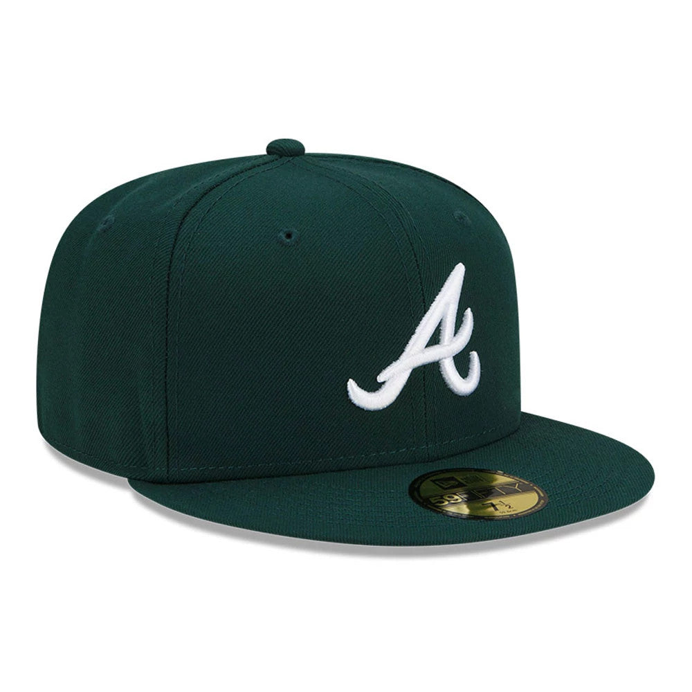 Atlanta Braves MLB Dark Green New Era 59FIFTY Fitted Cap, three-quarter view showing the raised white embroidered A logo on the structured dark green crown, complemented by a matching flat visor and a gold 59FIFTY size sticker on the visor.