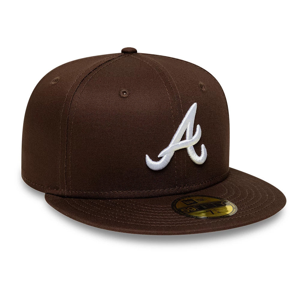 Atlanta Braves MLB Dark Brown New Era 59FIFTY Fitted Cap, three-quarter view showing the raised white embroidered Atlanta logo on the front panel, complemented by a dark brown flat visor and a gold 59FIFTY size sticker on the visor.