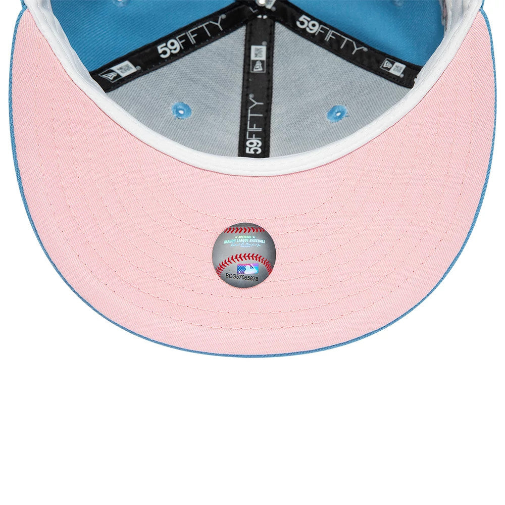 New York Yankees Pastel Blue New Era 59FIFTY Fitted Cap, inside view showing the pink undervisor with an MLB size sticker, black 59FIFTY taping along the seams and pastel blue fabric lining the crown panels.