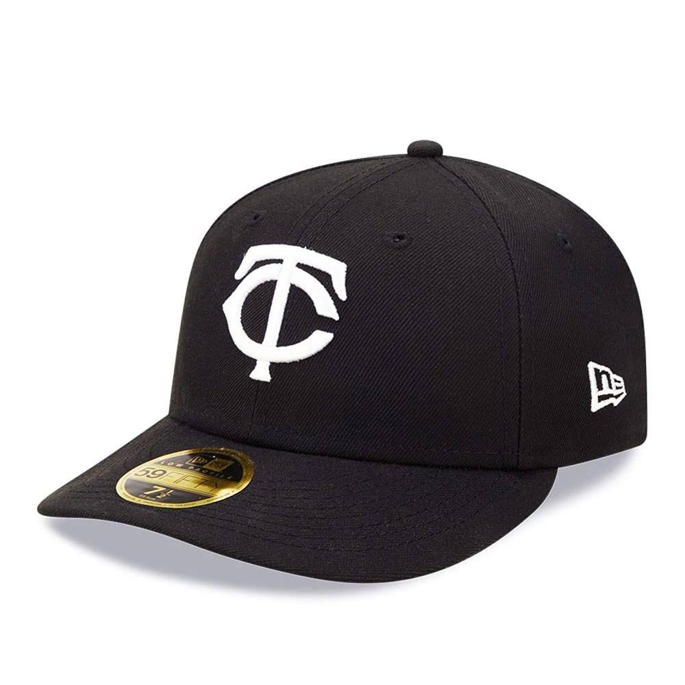 Minnesota Twins MLB Black Low Profile New Era 59FIFTY Fitted Cap, three-quarter view showing the white raised embroidered TC logo on the front panels, a curved black visor with a gold 59FIFTY size sticker, and the New Era flag logo on the left side.