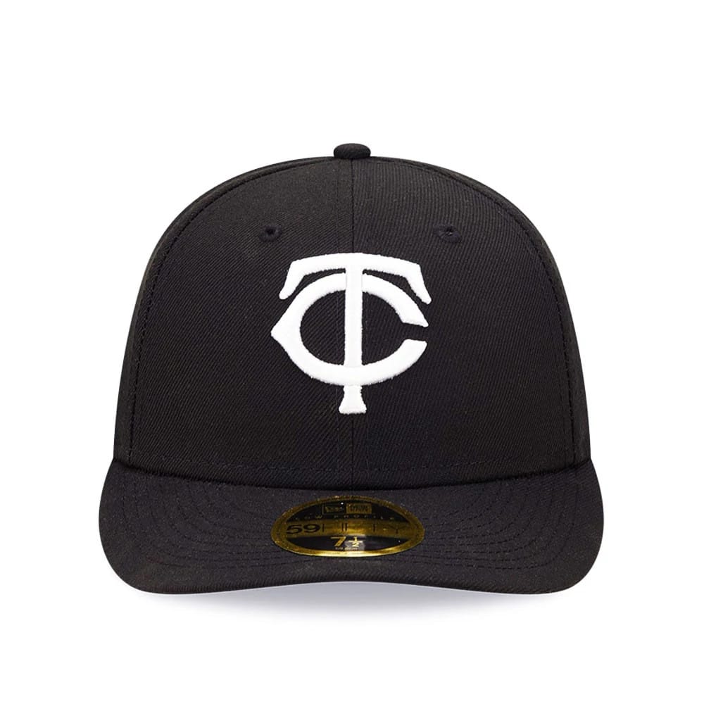 Minnesota Twins MLB Black Low Profile New Era 59FIFTY Fitted Cap, front view showing a white embroidered TC logo on the front panel, a curved black visor with a gold 59FIFTY size sticker, and matching black eyelets on the structured crown.