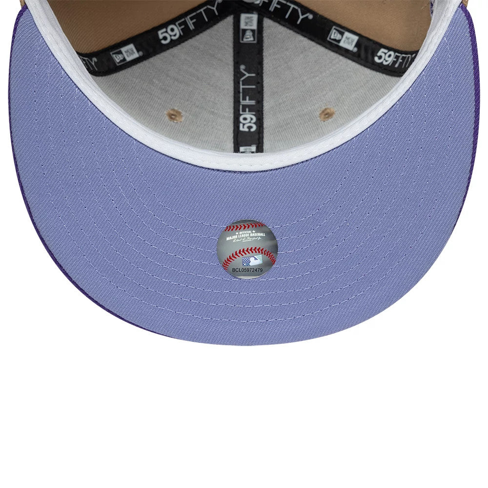Houston Astros MLB Cooperstown Beige New Era 59FIFTY Fitted Cap, inside view showing the black branded taping and grey sweatband, with a lilac undervisor featuring a baseball-shaped holographic sticker at its centre.