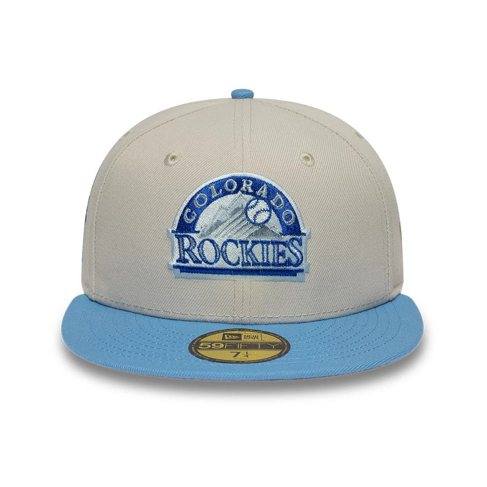 Colorado Rockies MLB Cooperstown Cream New Era 59FIFTY Fitted Cap, front view showing a blue and white embroidered Rockies logo on the cream front panel, light blue flat visor, and gold 59FIFTY size sticker on top.