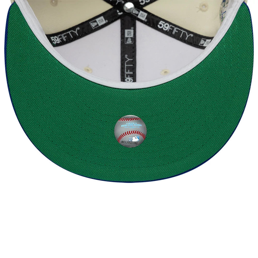 Texas Rangers MLB Cooperstown White & Blue New Era 59FIFTY Fitted Cap, inside view showing black 59FIFTY-branded taping across the cream panels, a white sweatband edge, and a green undervisor with a baseball-themed sticker at the centre.