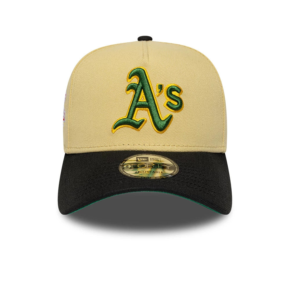 Athletics MLB Vegas Gold New Era 9FORTY A-Frame Cap, front view showing the green and yellow raised embroidered A's logo on the vegas gold crown, featuring a black curved visor with a 9FORTY size sticker and a green undervisor edge.