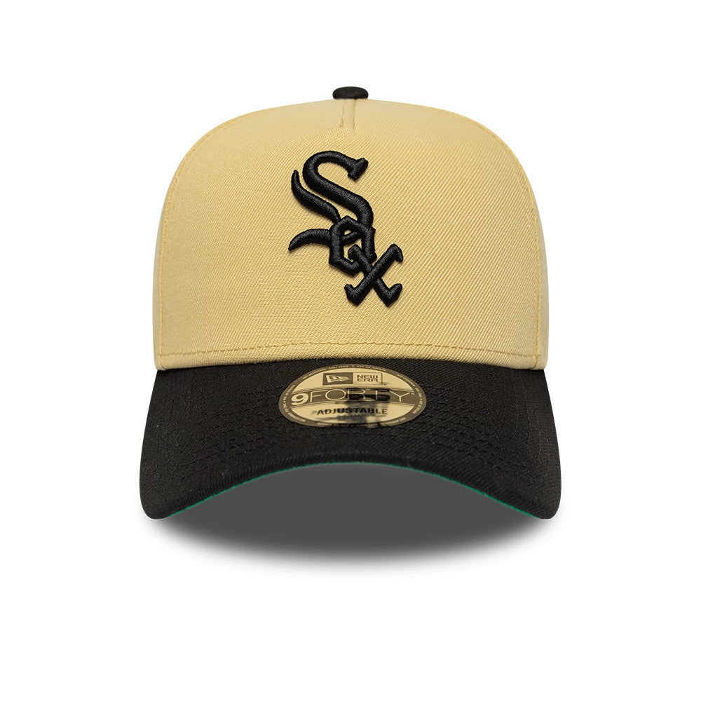 Chicago White Sox MLB Vegas Gold New Era 9FORTY A-Frame Cap, front view showing the raised black embroidered Sox logo on the vegas gold crown, with a contrasting black curved visor and a 9FORTY size sticker placed on the visor.