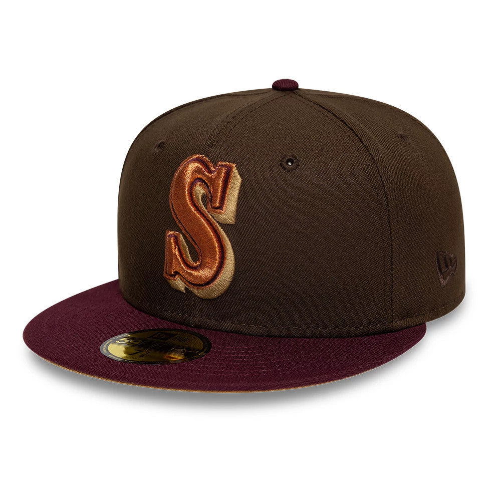Seattle Mariners MLB Cooperstown Dark Brown New Era 59FIFTY Fitted Cap, front view showing a raised embroidered S in orange and gold on the dark brown structured crown, with a maroon visor and a gold 59FIFTY size sticker.