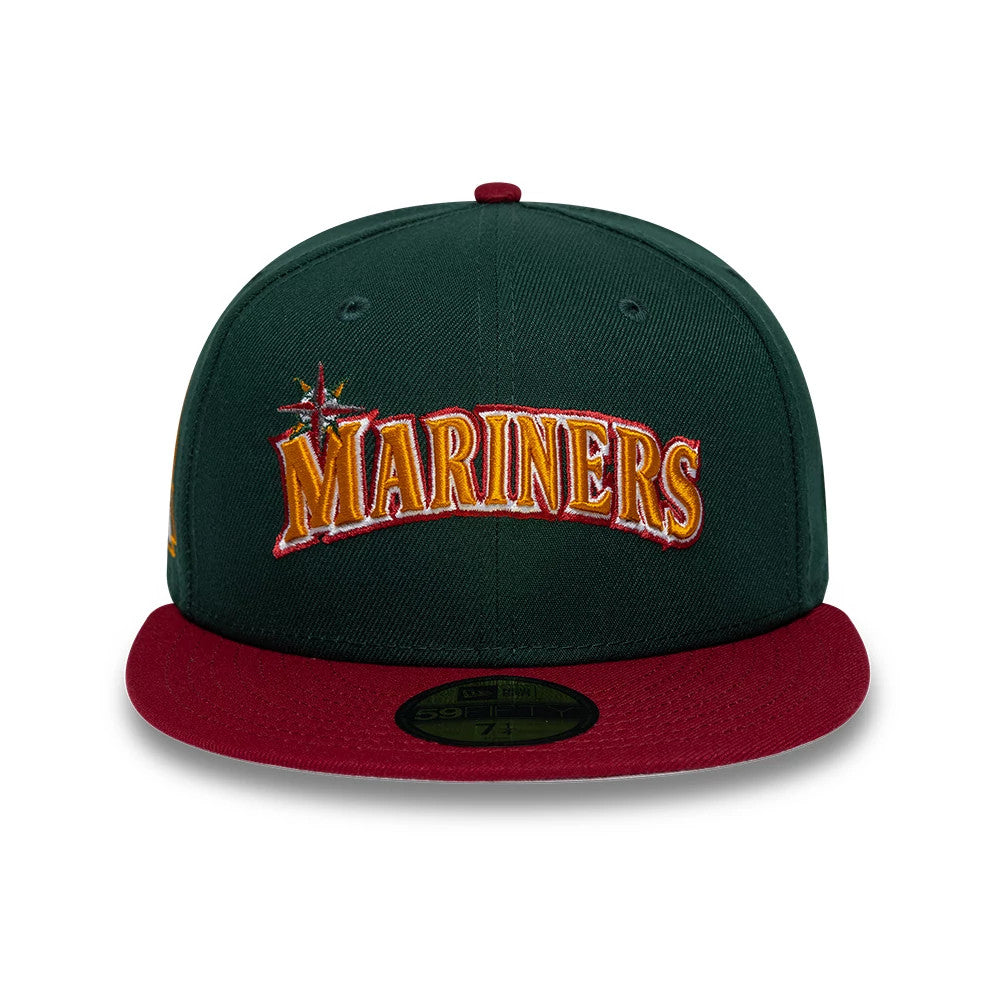 Seattle Mariners MLB Cooperstown Dark Green New Era 59FIFTY Fitted Cap, front view showing the raised orange and red embroidered Mariners logo on the structured dark green crown, with a burgundy flat visor and a gold 59FIFTY size sticker.