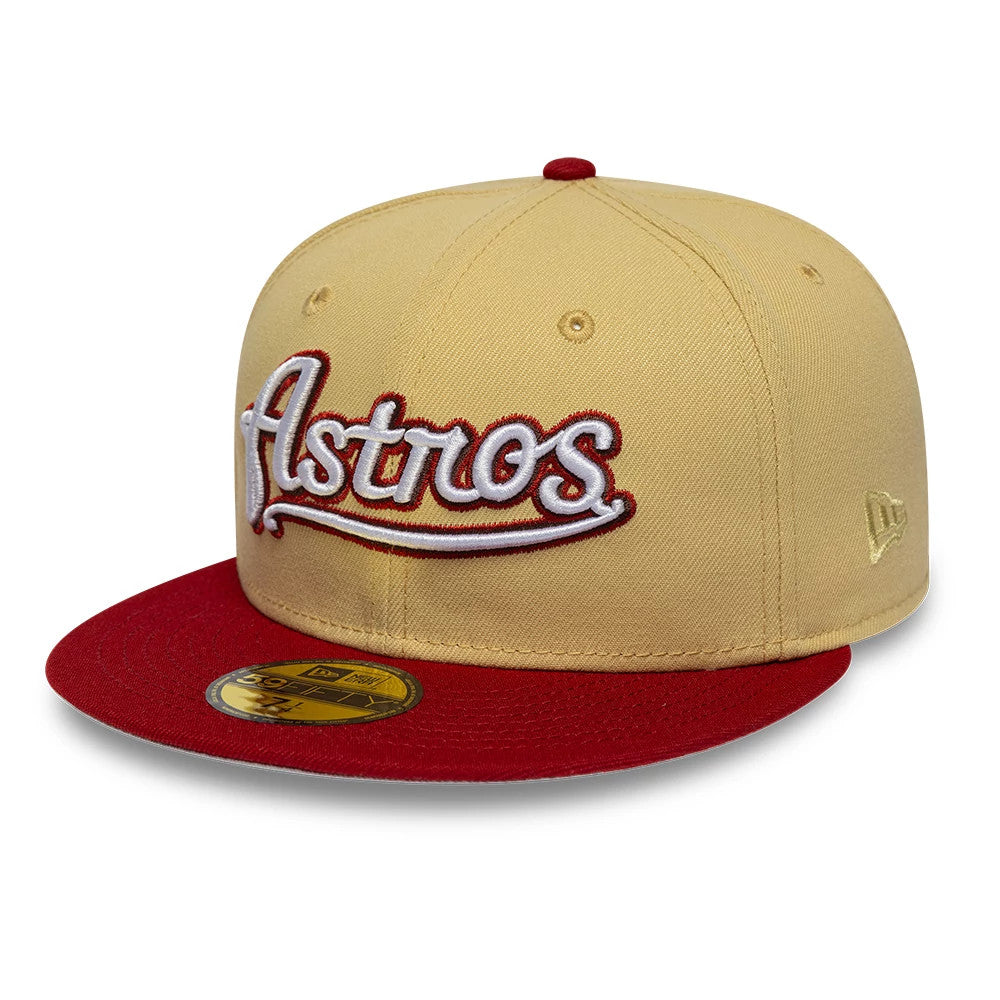 Houston Astros MLB Vegas Gold New Era 59FIFTY Fitted Cap, front view showing the raised embroidered Astros script logo in white with red outline on the front panel, a contrasting red flat visor, and a gold 59FIFTY size sticker.