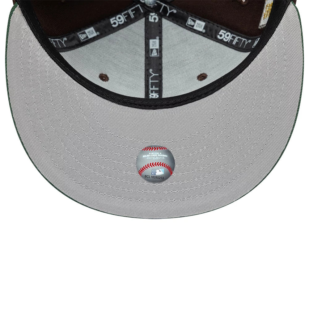 Houston Astros MLB Cooperstown Dark Brown & Green New Era 59FIFTY Fitted Cap, inside view showing grey undervisor with MLB sticker, dark taping featuring repeated 59FIFTY branding, and brown sweatband lining the structured crown.