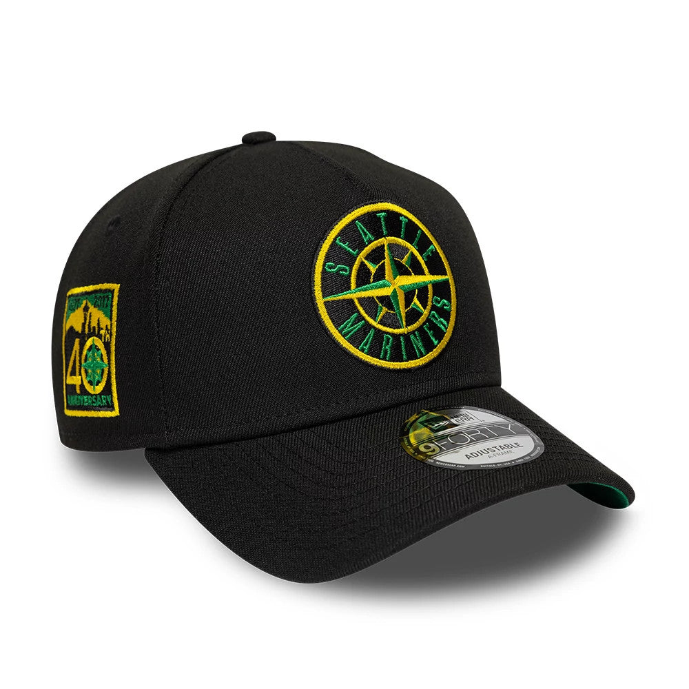 Seattle Mariners MLB Cooperstown Black New Era 9FORTY A-Frame Cap, three-quarter view showing a raised green and yellow embroidered logo on the front panel, a black curved visor with a 9FORTY size sticker, and an anniversary patch on the left side.