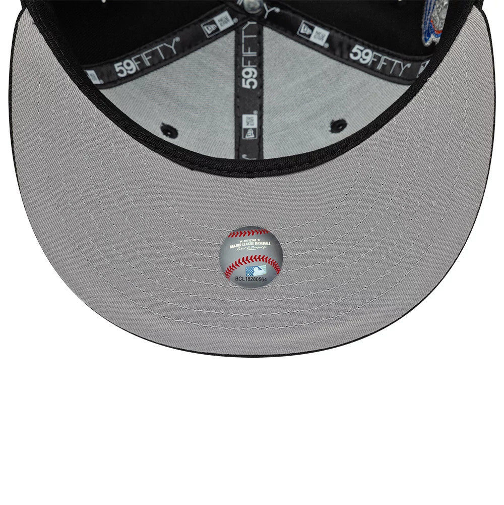 New York Yankees MLB Cooperstown Black New Era 59FIFTY Fitted Cap, inside view showing the black taping with white 59FIFTY branding, a grey undervisor with a round baseball-themed sticker, and a black sweatband lining the structured crown.