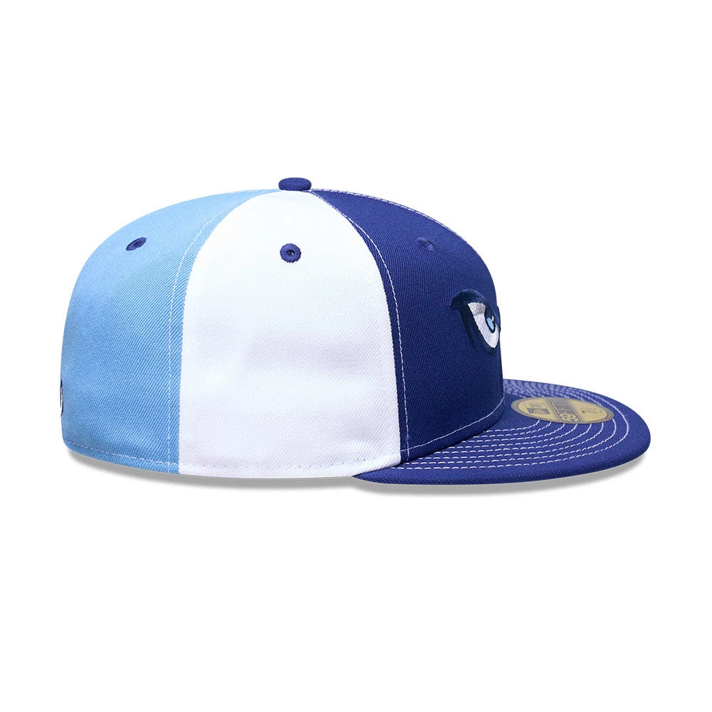 Lake Elsinore Storm MiLB Pinwheel Pastel Blue New Era 59FIFTY Fitted Cap, side view showing the embroidered eye logo on the blue panel, alternating pastel blue and white segments around the crown, with a flat blue visor and gold 59FIFTY size sticker.