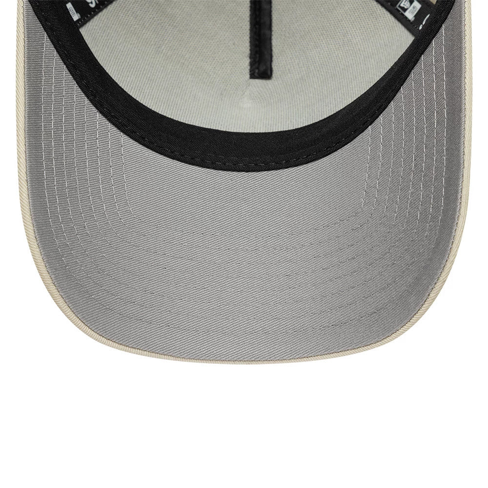 New Era Beige 9FORTY A-Frame Adjustable Cap, inside view showing a light grey undervisor with contrasting black edge trim, complemented by high-quality taping along the seam and a soft fabric sweatband for added comfort during wear.