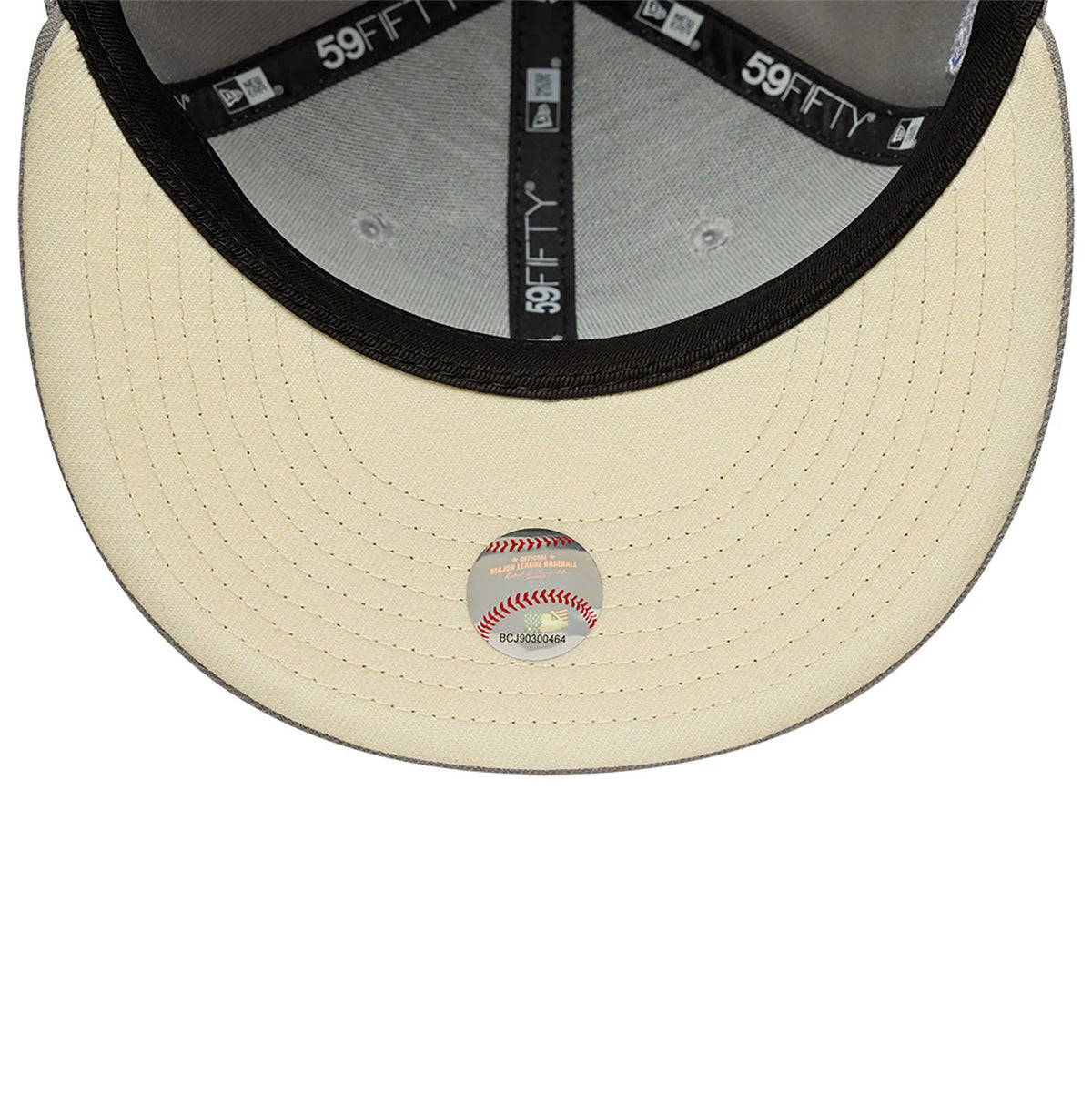 San Diego Padres Essential Pack Grey New Era 59FIFTY Fitted Cap, inside view showing the black taping with 59FIFTY branding, a light grey sweatband, and a cream undervisor with a small round baseball sticker at the centre.