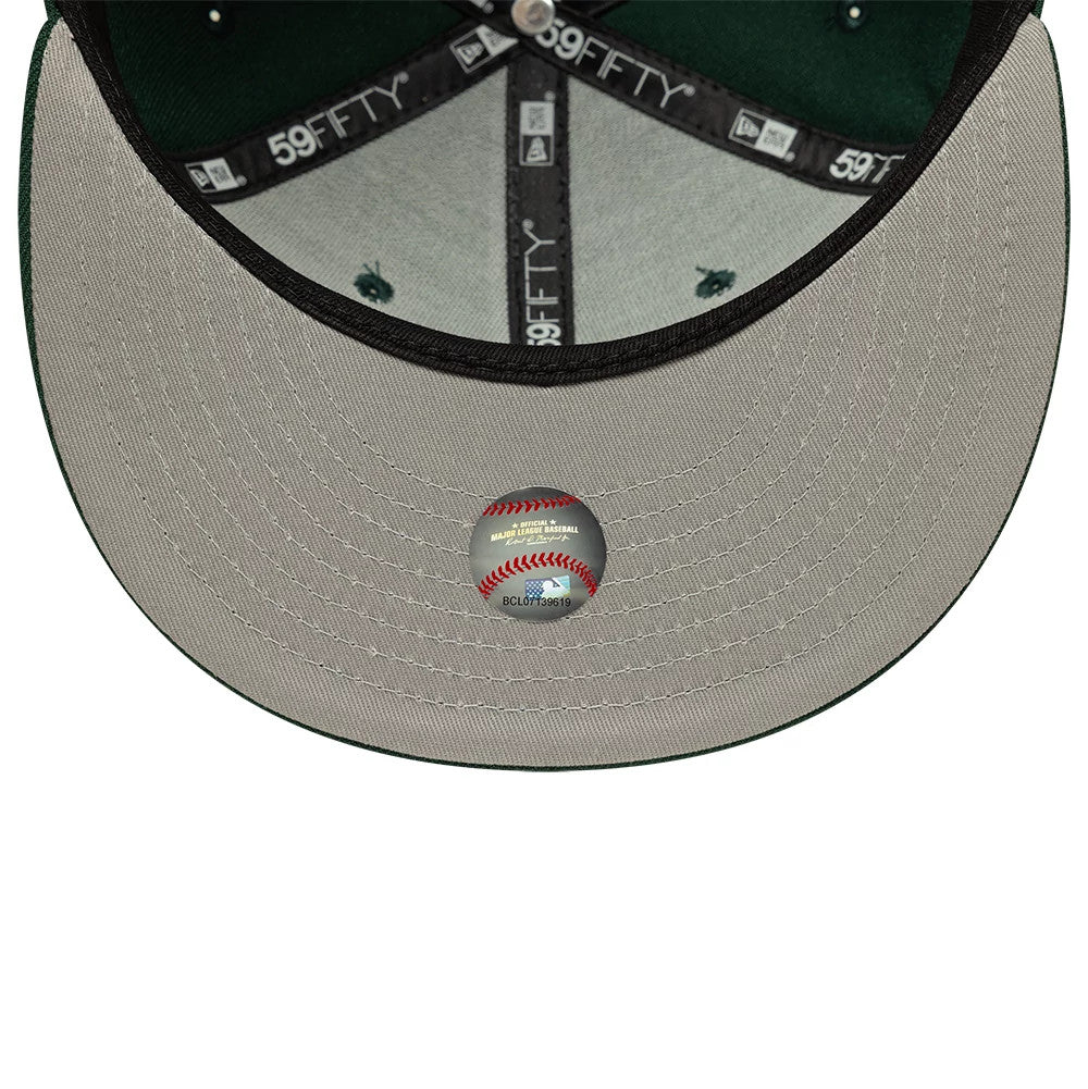 New York Yankees MLB Core Dark Green New Era 59FIFTY Fitted Cap, inside view showing a grey undervisor with a baseball sticker, black sweatband featuring 59FIFTY and New Era branding, and dark green taping with white text.