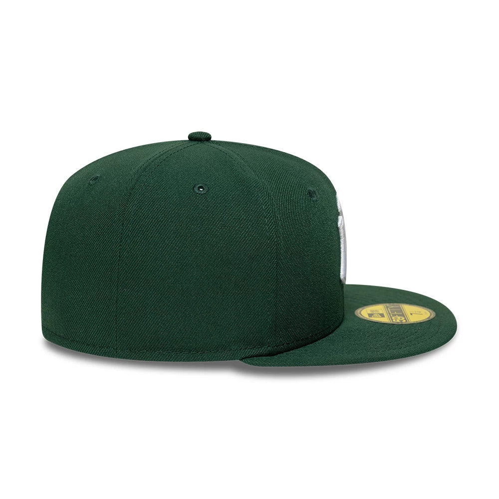 New York Yankees MLB Core Dark Green New Era 59FIFTY Fitted Cap, side view showing the embroidered New Era flag logo on the left side, with a structured dark green crown, and a flat dark green visor featuring the gold 59FIFTY size sticker.