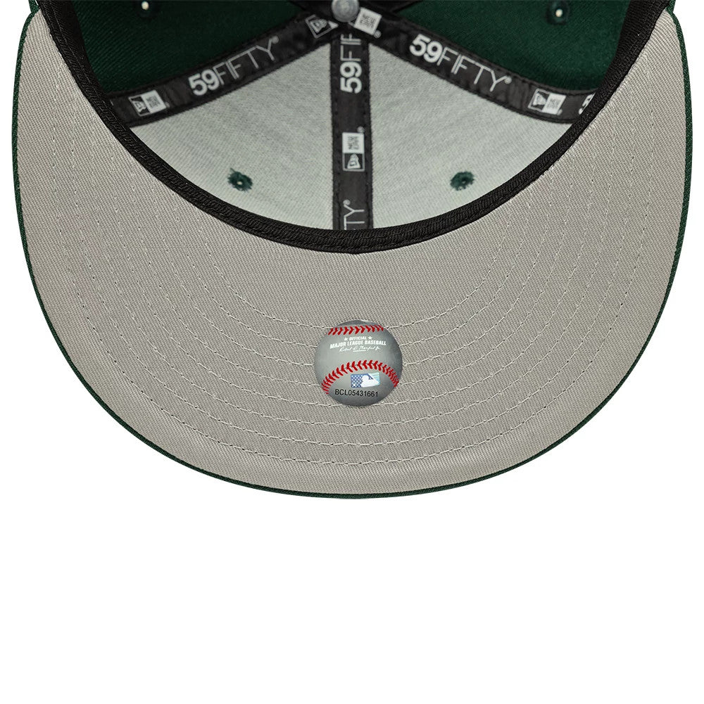 Detroit Tigers MLB Dark Green New Era 59FIFTY Fitted Cap, inside view showing the black 59FIFTY taping, grey sweatband, and a grey undervisor with an MLB baseball sticker in the centre.