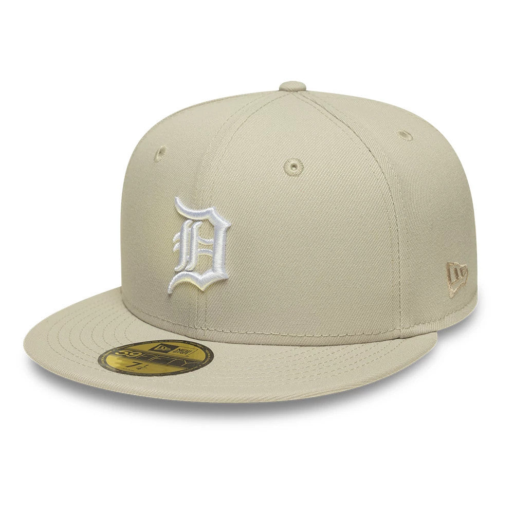 Detroit Tigers MLB Beige New Era 59FIFTY Fitted Cap, three-quarter view showing the raised white embroidered D logo on the front panel, a flat beige visor with a gold 59FIFTY size sticker, and the New Era flag logo on the left side.